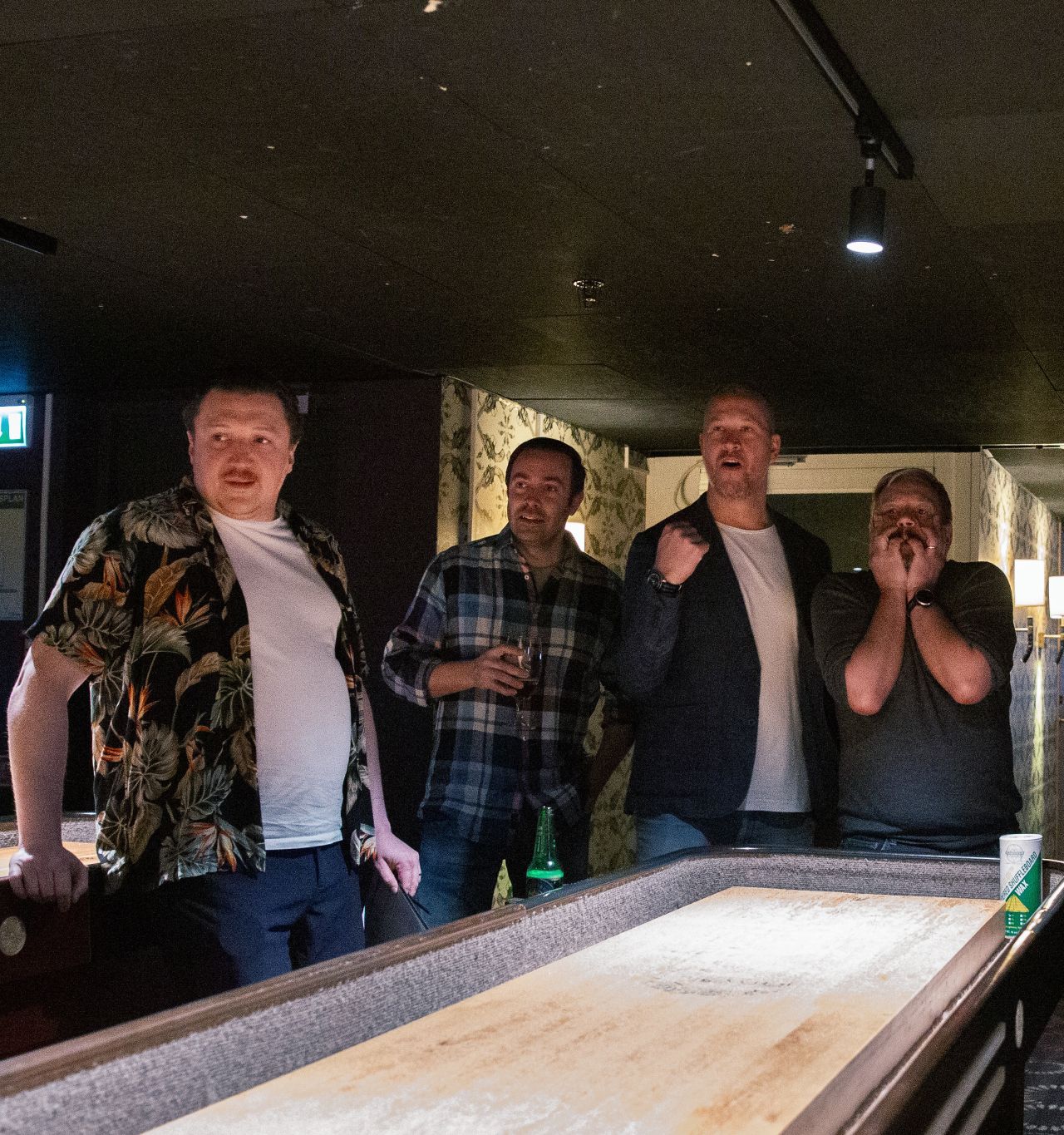 Nicklas and Philip focused on shuffleboard